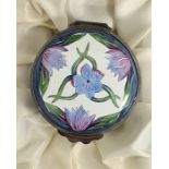 Moorcroft enamel trinket pot, cylindrical with blue cornflower and crocus decoration on a white