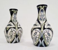 Pair of Moorcroft pottery vases, each ovoid with slender neck, tube-lined decoration of convulvous