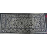 Cream ground modern rug, 175cm x 80cm and one further, red ground, 177cm x 80cm (2)
