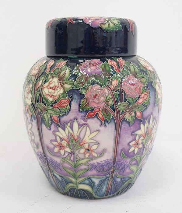 Moorcroft ginger jar decorated on a purple ground with white flowers and trees, marked to base '