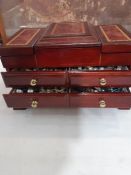 Quantity of costume jewellery and watches in folding jewellery chest