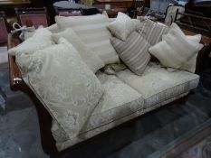 Modern drop-end settee, the light gold ground with foliate cream pattern, double-caned arms