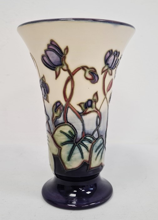 Moorcroft vase of tapering form, cream ground with blue base, violet decoration, initialled ‘JW’ and