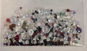 Bag of loose mixed stones including cubic zirconia, ruby, sapphire, emerald and other gemstones,