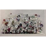 Bag of loose mixed stones including cubic zirconia, ruby, sapphire, emerald and other gemstones,
