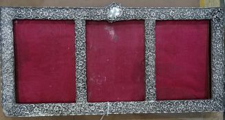 Late Victorian silver three image photo frame, with scrolling foliate decoration (38.5 x 19.5)