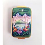 Moorcroft enamel patch box, rectangular and decorated with irises in lakeside landscape,