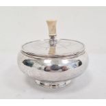 George VI Arts & Crafts-style silver circular lidded pot with turned ivory handle, the circular