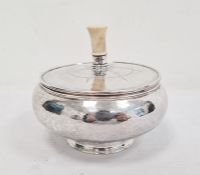 George VI Arts & Crafts-style silver circular lidded pot with turned ivory handle, the circular