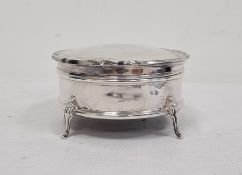 George V silver circular trinket box with hinged piecrust lid, with blue velvet interior, weighted