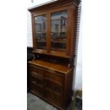 Edwardian walnut secretaire bookcase with ogee moulded pediment above two glazed doors enclosing