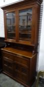 Edwardian walnut secretaire bookcase with ogee moulded pediment above two glazed doors enclosing