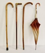 Horn-handled walking stick, 2 others and an umbrella (4)