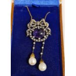 Bow-shaped drop necklace set with central cabochon cut amethyst, seed pearls, diamonds and 2