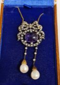 Bow-shaped drop necklace set with central cabochon cut amethyst, seed pearls, diamonds and 2