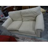 Two-seater sofa in oatmeal upholstery