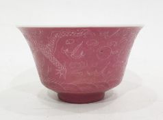 Chinese porcelain tea bowl with slightly everted rim, pink glaze and incised decoration of