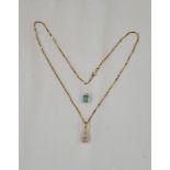 14K gold and white stone pendant set pear drop shaped stone, on fine 9ct gold twist chain and 10K