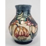 Moorcroft vase of baluster form, cream ground with pink flowers with green leaves, initialled ‘