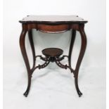 Mahogany centre table with shaped top, on cabriole supports uniting to a circular dished