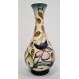 Moorcroft pottery baluster vase by R Bishop, cream ground with allover periwinkle decoration,