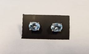 Pair of blue topaz studs, in silver