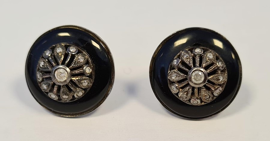 Pair of large studs set with diamond and surrounding black enamel, boxed