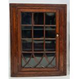 Oak wall-hanging corner display cabinet with astragal glazed door enclosing shelves, 88cm