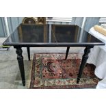 Oka black painted extending dining table on turned supports, extended length 230cm Condition