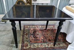 Oka black painted extending dining table on turned supports, extended length 230cm Condition