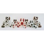 Collection of Staffordshire pottery spaniels to include pair copper lustre decorated spaniels, a