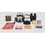 Zeiss Ikon camera in leather case, a Olympus 50mm F1.8 zoom lens and various other camera equipment