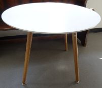 Modern circular breakfast table with white top, on four turned supports, 89cm diameter