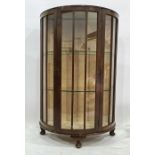 Early 20th century bowfront display cabinet with glass shelves