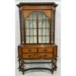 20th century display cabinet by Waring & Gillows, in walnut and kingwood, having ogee shaped