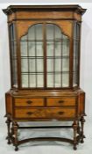 20th century display cabinet by Waring & Gillows, in walnut and kingwood, having ogee shaped