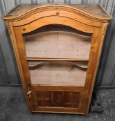 19th century continental display cabinet, the arched top above glazed and panelled door opening to