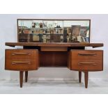 Mid 20th century G-Plan teak bedroom suite comprising dressing table, narrow chest of six drawers,