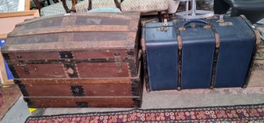 Brown leather covered dome-top trunk and one further trunk and contents (2)