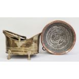 Two 19th century brass hand-beaten, repousse swing-handled coal bucket on four splayed supports