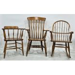 Elm seated captain's type chair, a modern comb-back rocking chair and one further armchair (3)