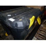 Large black and yellow  toolbox on wheels and four other double-decker tool boxes all with various