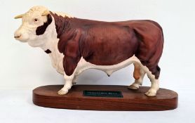 Beswick tinted bisque porcelain 'Connoisseur' model of a Hereford bull, on polished wooden plinth