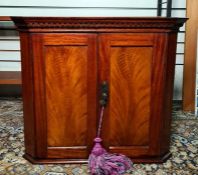 19th century wall-hanging mahogany two-door corner cabinet, 50.5cm high