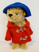 Steiff yellow label Paddington Bear, no. 661297 wearing blue felt hat, red duffel coat and fabric