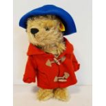 Steiff yellow label Paddington Bear, no. 661297 wearing blue felt hat, red duffel coat and fabric