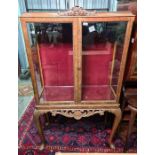 Early 20th century display cabinet with two glazed doors, raised on cabriole legs, 86.5cm x 156cm