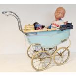 Large mid 20th century celluloid doll, a metal and coach built pram in pale blue and cream and other