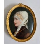 Probably early 20th century miniature portrait on porcelain of lady with white headscarf, brown