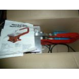 Black & Decker electric hedge trimmer, a boxed table jigsaw, two saw horses, a carpenter's toolbox